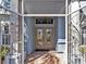 Elegant front doors, with glass inserts, that open to a welcoming foyer and tile flooring at 4419 Swift Cir, Valrico, FL 33596