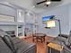 Relaxing living room with a wall-mounted TV, stylish decor, and cozy seating arrangements at 4419 Swift Cir, Valrico, FL 33596