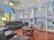 Inviting living area showcases a fireplace, custom built-ins, and refined finishes for a cozy ambiance at 4419 Swift Cir, Valrico, FL 33596