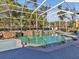 Private screened pool and spa surrounded by lush landscaping for relaxation and outdoor enjoyment at 4419 Swift Cir, Valrico, FL 33596