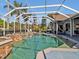 Inviting screened pool area featuring a spa, lounge chairs, and serene views of the surrounding landscape at 4419 Swift Cir, Valrico, FL 33596