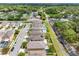 Aerial view of the neighborhood showcasing houses with backyards and neighborhood pools at 5946 81St N Ave, Pinellas Park, FL 33781