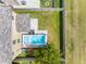 Aerial view of backyard featuring a swim spa, and a well-maintained lawn at 5946 81St N Ave, Pinellas Park, FL 33781