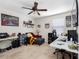 Bedroom with a ceiling fan, carpet, and decorations at 5946 81St N Ave, Pinellas Park, FL 33781