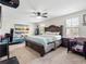 Spacious bedroom boasting natural light and ample space for a large bed and a baby crib at 5946 81St N Ave, Pinellas Park, FL 33781