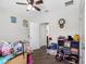 bedroom with ceiling fan and a playful arrangement of toys and furniture at 5946 81St N Ave, Pinellas Park, FL 33781