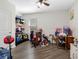 Spare bedroom with toys, crafting area, ceiling fan, and natural light from the window at 5946 81St N Ave, Pinellas Park, FL 33781