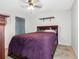Tranquil bedroom with a large bed, a ceiling fan, and soft lighting promoting relaxation and restful nights at 5946 81St N Ave, Pinellas Park, FL 33781