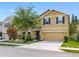 Charming two-story home with a well-maintained lawn, inviting curb appeal, and a spacious driveway at 5946 81St N Ave, Pinellas Park, FL 33781