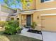 Inviting front entrance with a stylish door, green plants, and a well-manicured lawn at 5946 81St N Ave, Pinellas Park, FL 33781