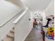 Inviting hallway with stairway, decorative touches, and a glimpse into the dining area at 5946 81St N Ave, Pinellas Park, FL 33781