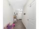 Hallway view featuring a staircase, an entertainment machine, and easy access to other rooms at 5946 81St N Ave, Pinellas Park, FL 33781