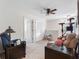 Bright living room featuring carpeted floors, neutral walls, and a ceiling fan for comfortable living at 5946 81St N Ave, Pinellas Park, FL 33781