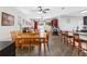 Open-concept space with a dining table, living room, and kitchen, creating a connected living experience at 5946 81St N Ave, Pinellas Park, FL 33781