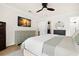 Nicely decorated primary bedroom with a ceiling fan, access to the pool, and a connecting bathroom at 611 Limetree Dr, Oldsmar, FL 34677