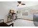Bright bedroom featuring a ceiling fan, modern desk setup, and ample natural light at 611 Limetree Dr, Oldsmar, FL 34677