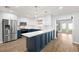 Beautifully updated kitchen with stainless steel appliances, granite countertops, and light-colored wood look flooring at 611 Limetree Dr, Oldsmar, FL 34677