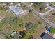 Another aerial shot of the property highlighting the lot size, neighborhood context, and tree cover at 7169 Spruce Dr, Weeki Wachee, FL 34607