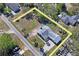 Aerial view of the property outlined showing the boundaries of the parcel, street access, and nearby homes at 7169 Spruce Dr, Weeki Wachee, FL 34607
