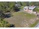 Aerial backyard view featuring a large yard and mature trees at 7169 Spruce Dr, Weeki Wachee, FL 34607