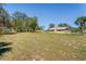 Aerial backyard view featuring a large yard and brick home at 7169 Spruce Dr, Weeki Wachee, FL 34607