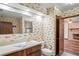 This bathroom features ship themed wall paper and a door leading to another room at 7169 Spruce Dr, Weeki Wachee, FL 34607