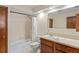 Bathroom features a shower-tub combination, toilet, and vanity with sink at 7169 Spruce Dr, Weeki Wachee, FL 34607
