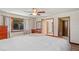 Bright bedroom features natural light, wood flooring, ceiling fan, and comfortable layout at 7169 Spruce Dr, Weeki Wachee, FL 34607