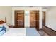 This bedroom features two cedar closets with interior shelving, rod, and overhead light at 7169 Spruce Dr, Weeki Wachee, FL 34607