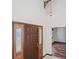 Inviting foyer with a dark wood front door and casing, opens to main living area at 7169 Spruce Dr, Weeki Wachee, FL 34607