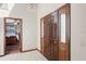 Inviting foyer with tile flooring and a dark wood front door and casing at 7169 Spruce Dr, Weeki Wachee, FL 34607