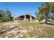 View of the front exterior featuring a nice grassy yard and modern design at 7169 Spruce Dr, Weeki Wachee, FL 34607