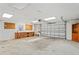 View of the garage interior featuring a large workspace area at 7169 Spruce Dr, Weeki Wachee, FL 34607