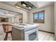 Kitchen featuring a brick island with seating and access to an adjacent living room with nice backyard view at 7169 Spruce Dr, Weeki Wachee, FL 34607