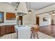 Cozy kitchen features a brick island with seating, white countertops, and ample natural light at 7169 Spruce Dr, Weeki Wachee, FL 34607