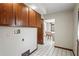The laundry room provides plenty of cabinets for storage and access to another room at 7169 Spruce Dr, Weeki Wachee, FL 34607