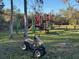 Community playground area featuring swings, slides, and play equipment, creating a fun space for children at 7169 Spruce Dr, Weeki Wachee, FL 34607