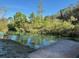 Scenic waterfront view with crystal clear waters and lush green vegetation, offering a peaceful retreat at 7169 Spruce Dr, Weeki Wachee, FL 34607