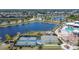 Community tennis and basketball courts near a playground, pool, and beautiful lake at 7215 Wash Island Dr, Sun City Center, FL 33573