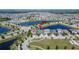Aerial view showing location, community, pond and convenient access to shopping areas and more at 7215 Wash Island Dr, Sun City Center, FL 33573