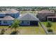 The backyard features a lovely view, and the home is nestled between two other houses at 7215 Wash Island Dr, Sun City Center, FL 33573