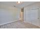 A standard bedroom features a double-door closet with neutral paint and carpeted floors at 7215 Wash Island Dr, Sun City Center, FL 33573