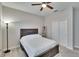 Bedroom with ceiling fan, natural light, closet with double doors, and wood furniture at 7215 Wash Island Dr, Sun City Center, FL 33573