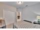 Bedroom with a queen bed, ceiling fan, double door closet and bright, natural light source at 7215 Wash Island Dr, Sun City Center, FL 33573