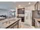 Open kitchen with stainless steel appliances and easy access to the adjacent living areas at 7215 Wash Island Dr, Sun City Center, FL 33573