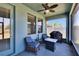Inviting screened lanai with grill, seating, and views of the fenced backyard at 7215 Wash Island Dr, Sun City Center, FL 33573