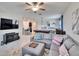Inviting living space with open floorplan, connecting living room, game room and kitchen at 7215 Wash Island Dr, Sun City Center, FL 33573