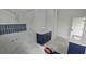 Modern bathroom with dual vanities, stylish tile work, and a walk-in shower at 745 31St N Ave, St Petersburg, FL 33704