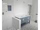 Modern bathroom featuring double vanity, marble shower, and patterned tile flooring at 745 31St N Ave, St Petersburg, FL 33704