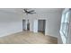 Spacious bedroom with light hardwood floors, ceiling fan, and neutral paint at 745 31St N Ave, St Petersburg, FL 33704